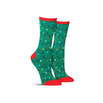 Green and red women's socks with strands of festive Christmas lights