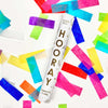 Cardboard tube that shoots out multicolor tissue confetti