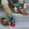 A man wearing Christmas reindeer socks